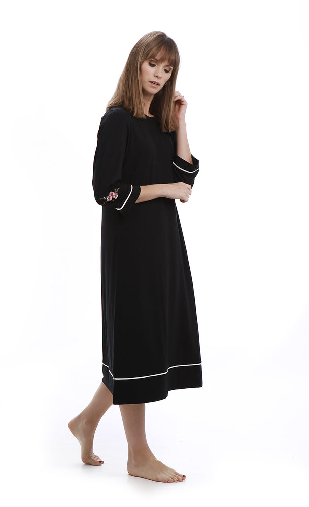 Eminently comfortable and effortlessly chic, this is the perfect little black (night)dress.    Features:  Nightdress:  Knee length 3/4 sleeves Embroidered detail Round neck Cardigan:  Button down closure Patch pockets