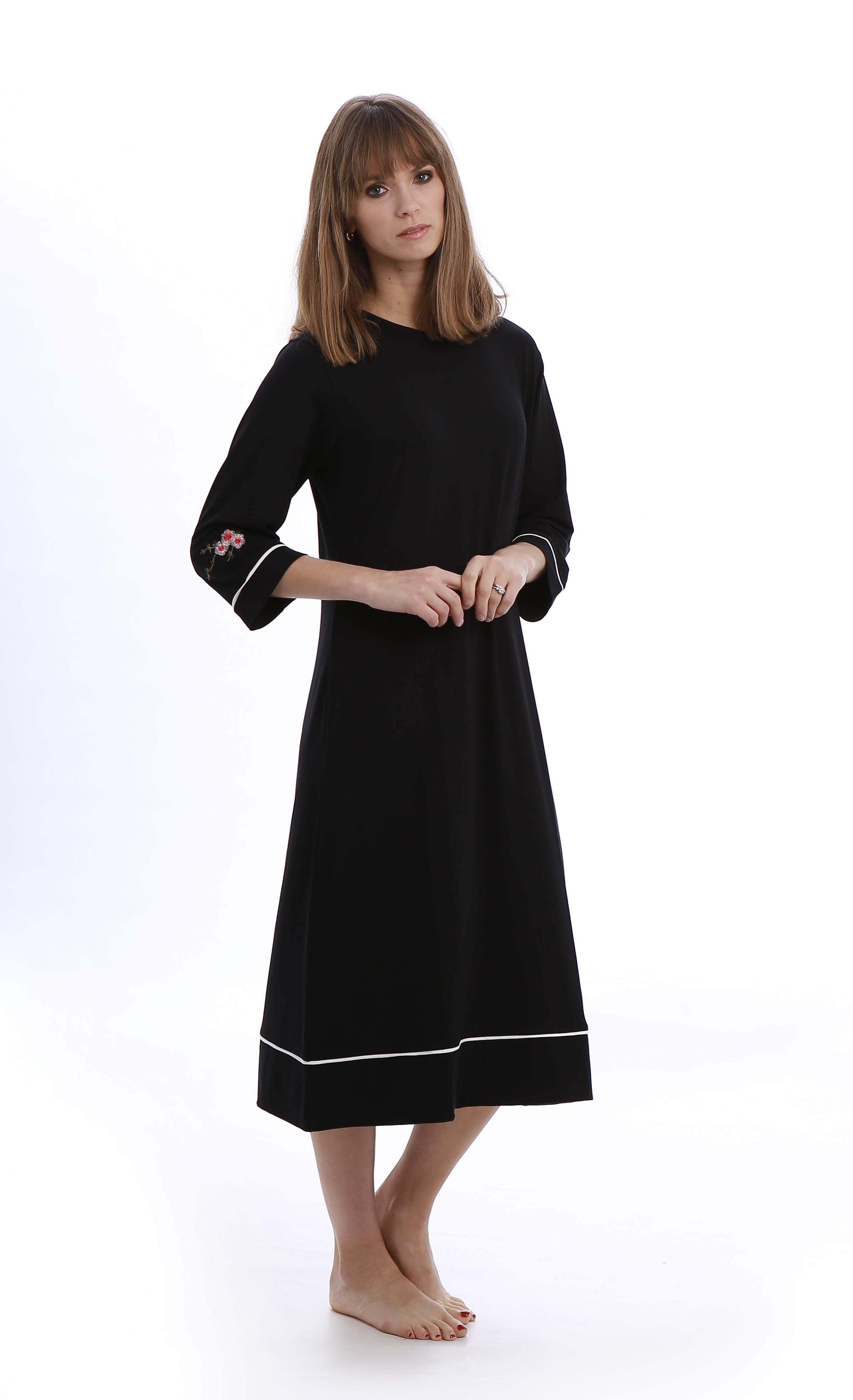 Eminently comfortable and effortlessly chic, this is the perfect little black (night)dress.    Features:  Nightdress:  Knee length 3/4 sleeves Embroidered detail Round neck Cardigan:  Button down closure Patch pockets
